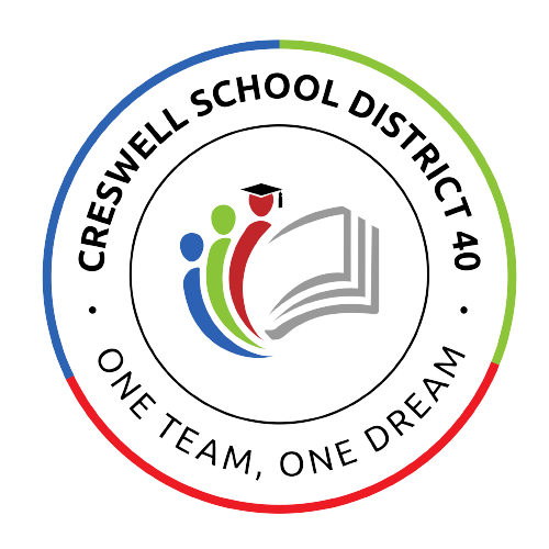 Creswell SD logo: Circle with image of 3 people silhouettes and book pages in the center and "Creswell School District 40 - One Team, One Dream" text surrounding in the outer circular ring